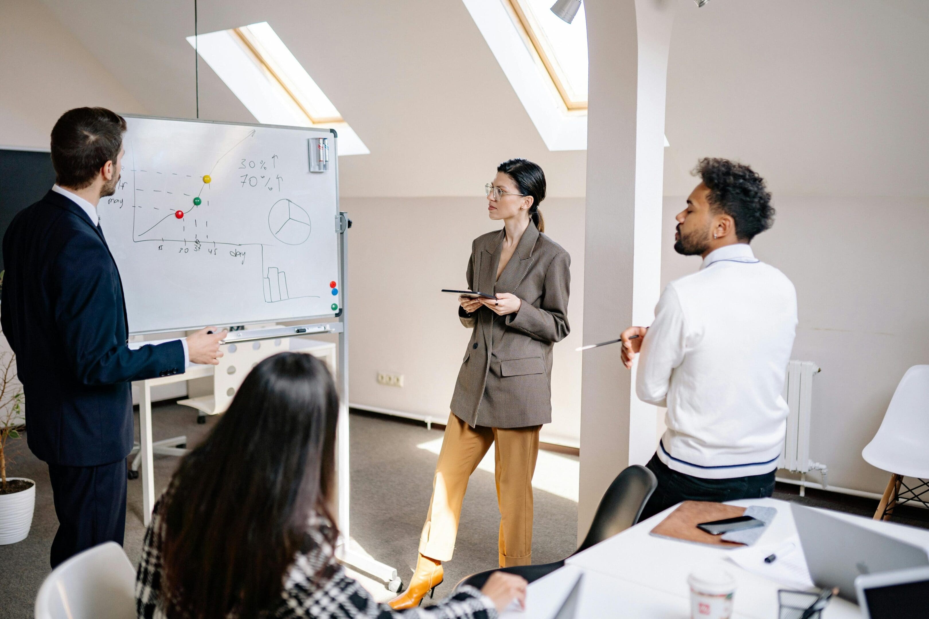 A group of people in an office setting.